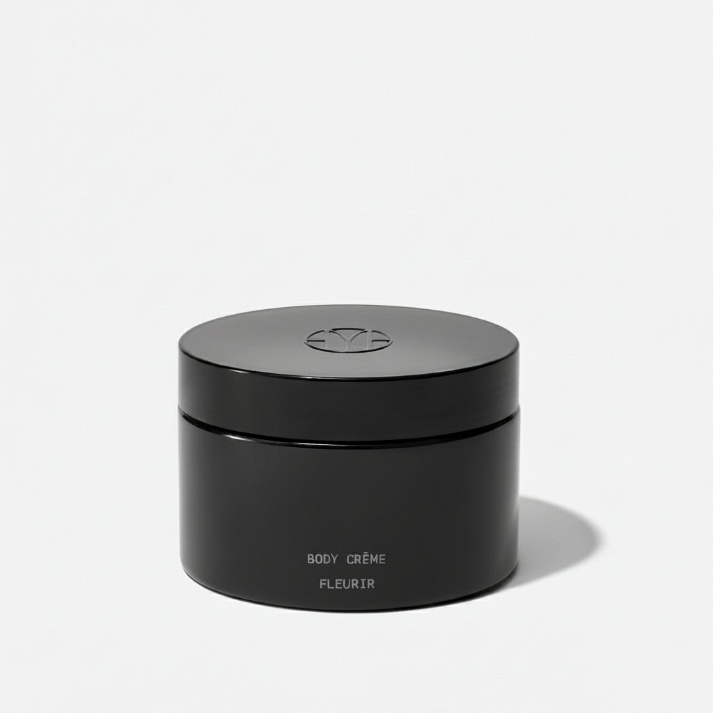 Black jar labeled 'BODY CREME FLEURIR' on a white background